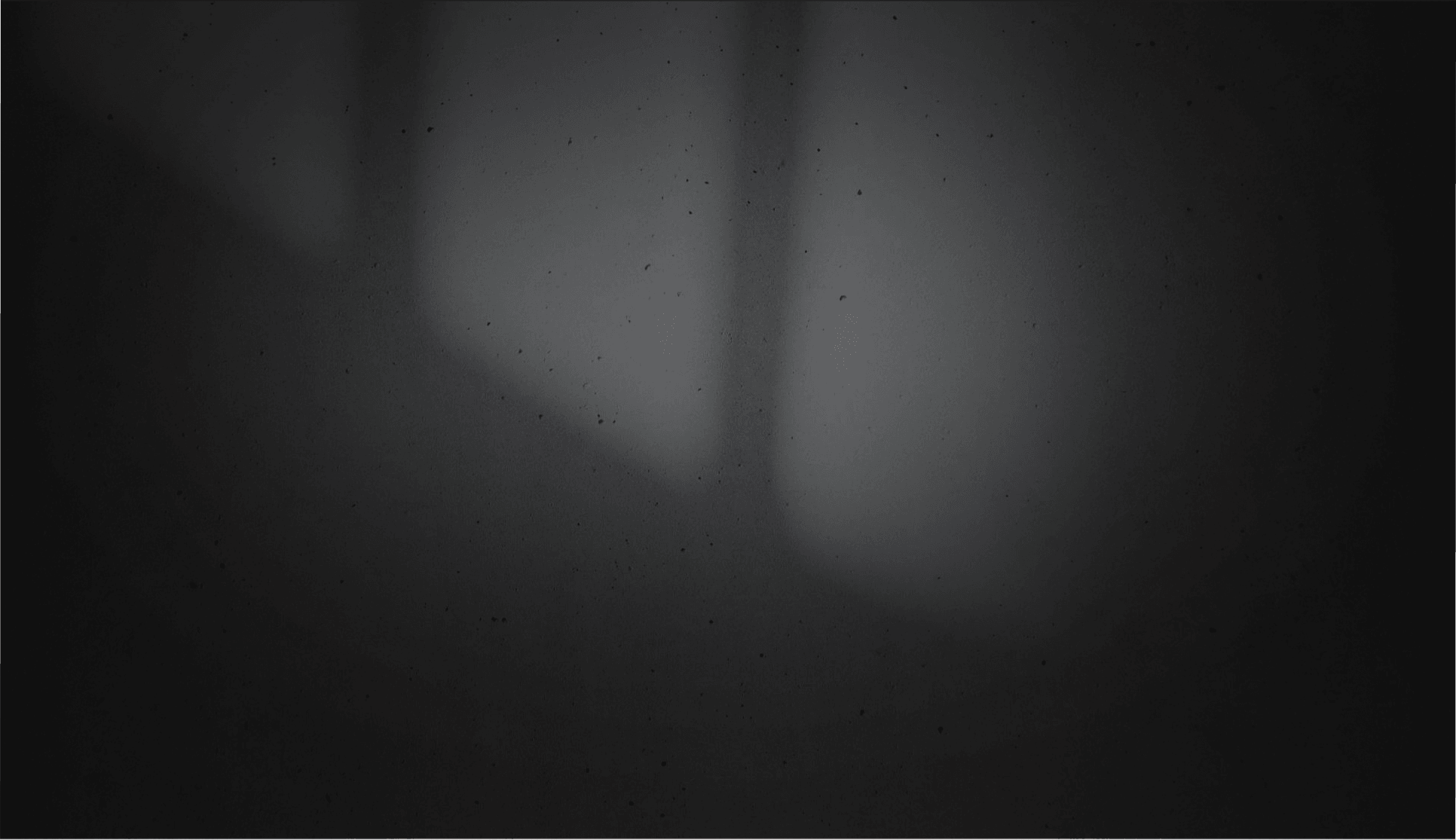 Black background with white blurred lights on it